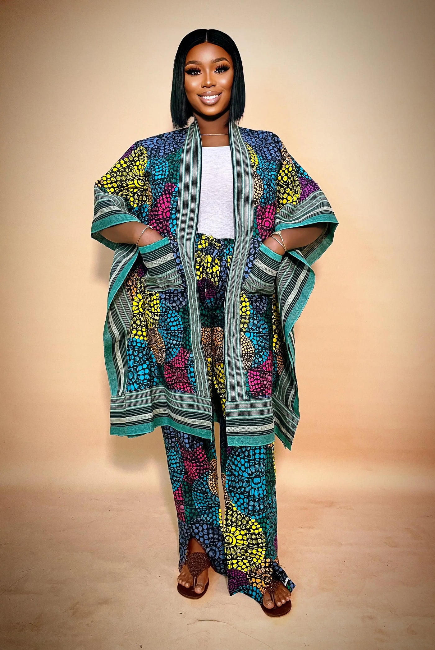 Woman wearing a colorful African Kimono & Palazzo Two Piece wear on a beige background