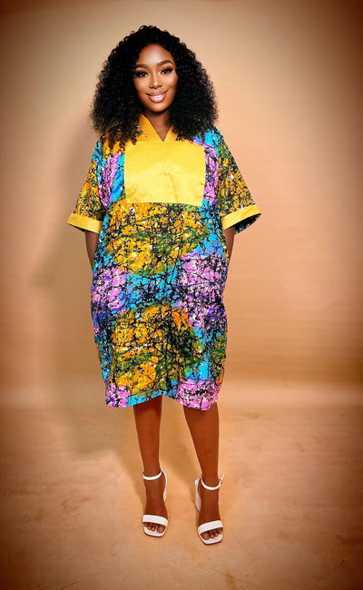 Woman wearing an African Multicolored Short Bubu Gown against a brown background