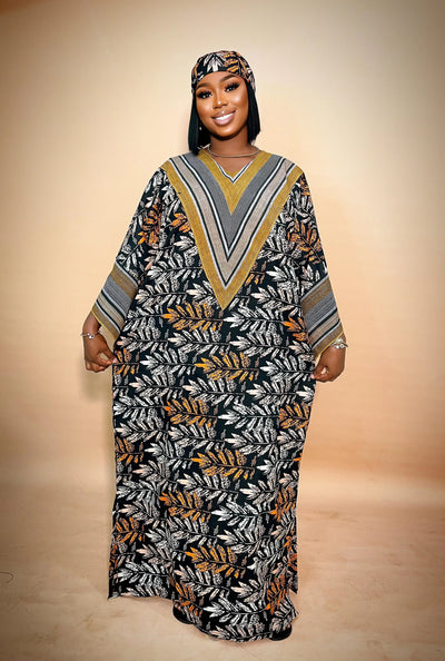 Woman wearing a patterned dress with a matching headscarf on a beige background