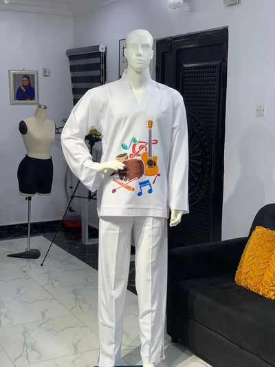 Mannequin wearing a white Long Sleeve Kaftan 2 Piece with African Print  in a room setting.