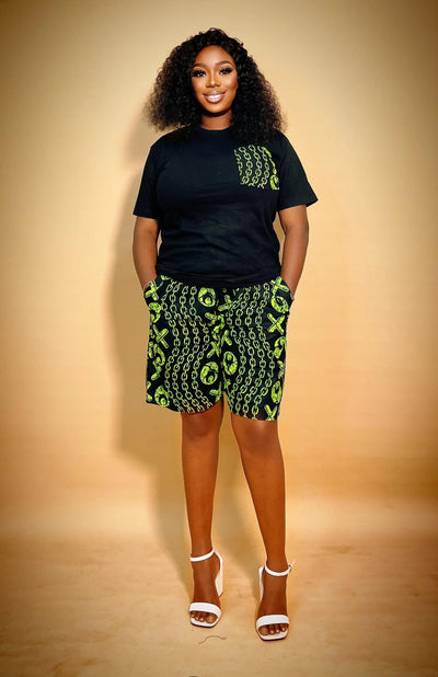 Woman wearing an Ankara Matching Set for Women with green patterns on a beige background