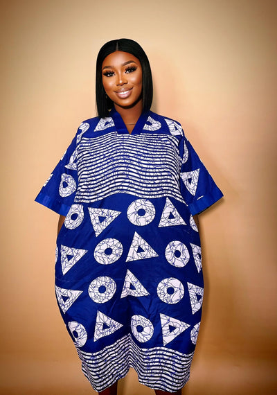 Woman wearing our African Print Bubu Gown dress against a beige background